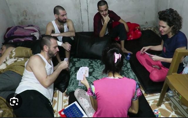 This footage published on December 11, 2025, after being obtained by the IDF from Gaza, shows hostages Hersh Goldberg-Polin, Eden Yerushalmi, Ori Danino, Alex Lobanov, Carmel Gat, and Almog Sarusi in Hamas captivity in late 2023. (Courtesy)
