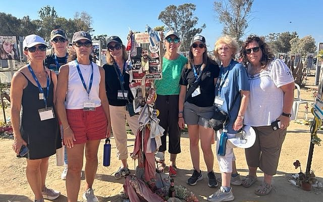 (Pictured left to right:) Tracy Lowenthal, Erika Heeres, Nina Friedman, Sue Zipkoff, Cheryl Mell, Erin Kerpel, Carole Mangurteen, Debbie Copley, Nova Festival site, 2025. Photo courtesy of the author.