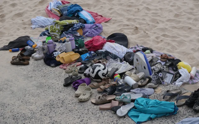 Belongings gathered on the beach, after a shooting the day before, at Sydney's Bondi Beach, December 15, 2025. (AP Photo/ Mark Baker)