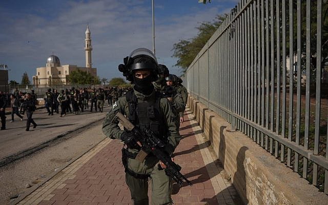 Police and Border Police officers operating in the Bedouin town of Tarabin al-Sana, as part of a days-long crackdown in the southern village on December 30, 2025. (Israel Police)