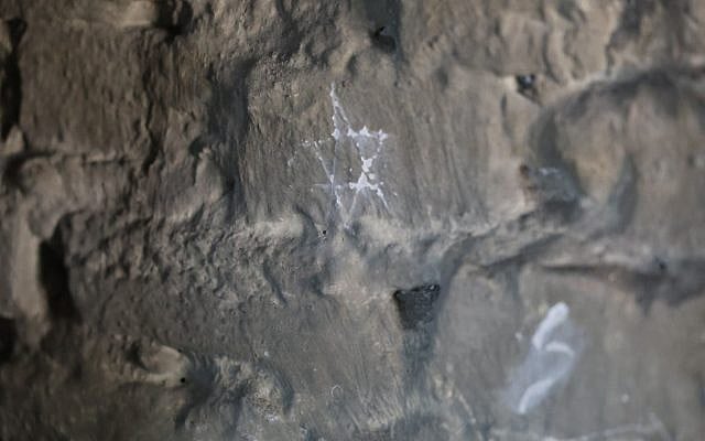 A Star of David etched into the gas chamber wall in Auschwitz-Birkenau (Photo Credit: Margaux Betesh)