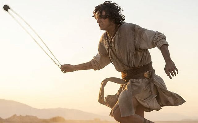 A promotional image for "House of David" shows David wielding his slingshot against Goliath. (Photo by Jonathan Prime for Amazon Content Services LLC)