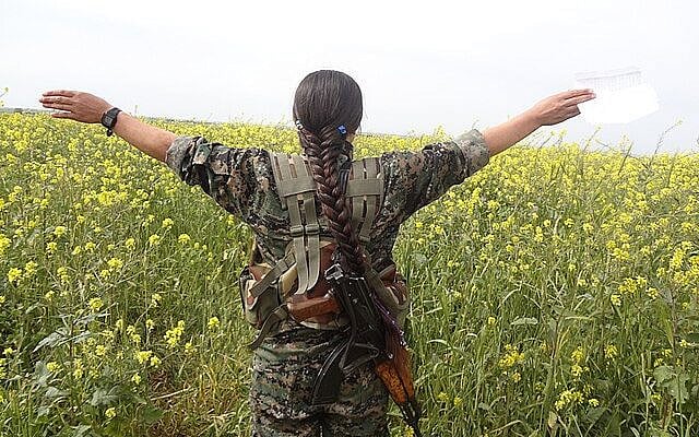 Kurdish YPG Fighter (16625309233).jpg” by Kurdishstruggle, via Wikimedia Commons, licensed under CC BY 2.0 (https://creativecommons.org/licenses/by/2.0/