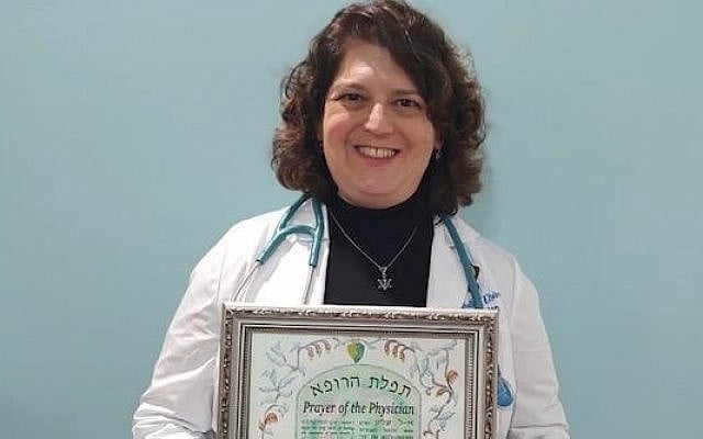 Dr. Michelle Elisburg pictured with her Oath of Maimonides. Photo courtesy of the author.