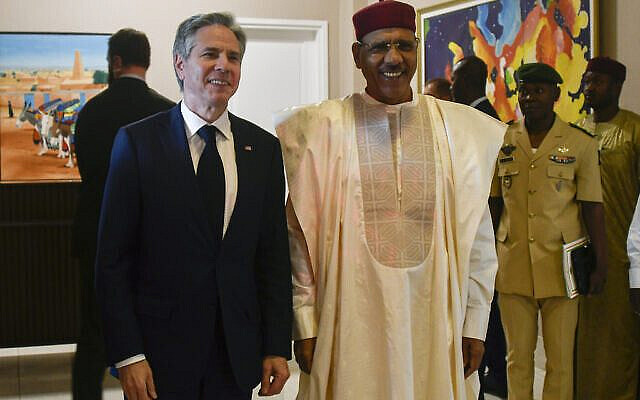 US Secretary of State Antony Blinken, left, poses for a photo with Nigerien President Mohamed Bazoum during their meeting at the presidential palace in Niamey, Niger, Thursday, March 16, 2023. Blinken traveled to Ethiopia and Niger as the Biden administration accelerates a push to engage with Africa to counter China's growing influence on the continent. (Boureima Hama/Pool Photo via AP) US Secretary of State Antony Blinken, left, poses for a photo with Nigerien President Mohamed Bazoum during their meeting at the presidential palace in Niamey, Niger, Thursday, March 16, 2023. Blinken traveled to Ethiopia and Niger as the Biden administration accelerates a push to engage with Africa to counter China's growing influence on the continent. (Boureima Hama/Pool Photo via AP)