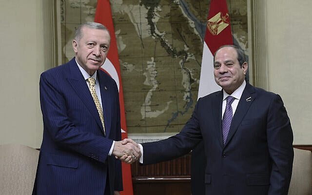 In this handout photo released by Turkish Presidency, Turkey's President Recep Tayyip Erdogan, left, shakes hands with Egyptian President Abdel Fattah Al-Sissi during their meeting at Al-Ittihadiya palace in Cairo, Egypt, Wednesday, Feb. 14, 2024. (Turkish Presidency via AP) In this handout photo released by Turkish Presidency, Turkey's President Recep Tayyip Erdogan, left, shakes hands with Egyptian President Abdel Fattah Al-Sissi during their meeting at Al-Ittihadiya palace in Cairo, Egypt, Wednesday, Feb. 14, 2024. (Turkish Presidency via AP)
