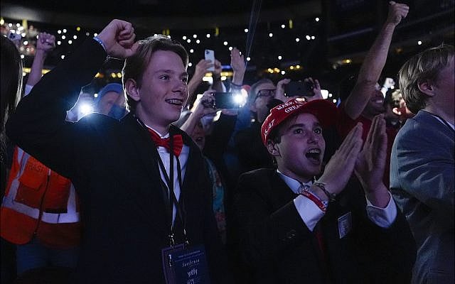 Supporters cheer as Republican presidential nominee former President Donald Trump speaks with Tucker Carlson during a Tucker Carlson Live Tour show at Desert Diamond Arena, Thursday, October 31, 2024, in Glendale, Ariz. (AP Photo/Julia Demaree Nikhinson)