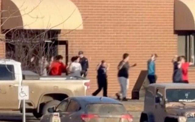 This grab from video shows students exiting the Tumbler Ridge school after deadly shootings, in British Columbia, Canada, Tuesday Feb. 10, 2026. (Jordon Kosik via AP)