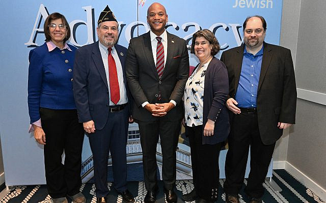Jewish Federation of Annapolis & the Chesapeake board members Jennifer Laszlo Mizrahi, Arnold Abraham, Rabbi Faith Cantor and Michael Tanenhaus surround Governor Wes Moore before he spoke to 300+ Jewish advocates. Photo by and courtesy of the government of Maryland. Jewish Federation of Annapolis & the Chesapeake board members Jennifer Laszlo Mizrahi, Arnold Abraham, Rabbi Faith Cantor and Michael Tanenhaus surround Governor Wes Moore before he spoke to 300+ Jewish advocates. Photo by and courtesy of the government of Maryland.