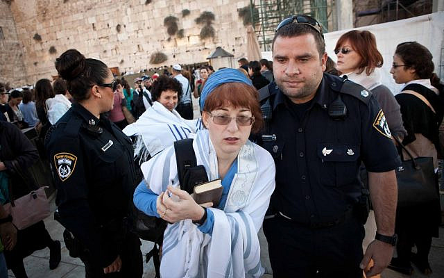 Illustrative. A woman is arrested for wearing a prayer shawl at the Western Wall in November 2012. (courtesy, Woman of the Wall)