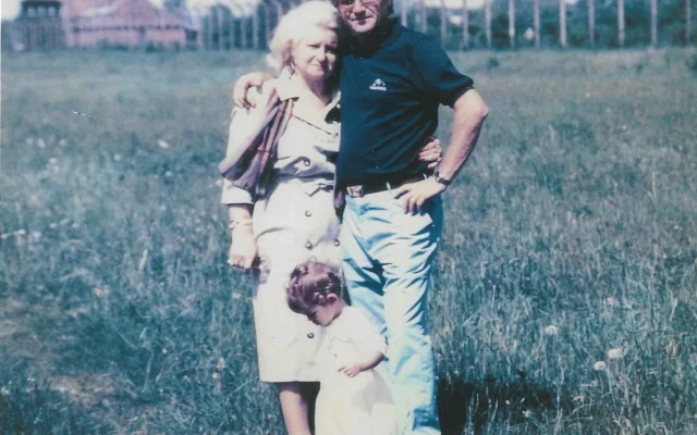 Edna and Harry Brill with their first grandchild, Rachel Alana, at Auschwitz-Birkenau. June 1989. Image from Edna Brill's personal collection.