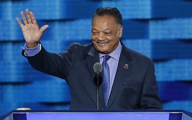 Reverend Jesse Jackson waves as he steps to the podium during the third day of the Democratic National Convention in Philadelphia, Pennsylvania, on July 27, 2016. (AP Photo/ J. Scott Applewhite/ File)