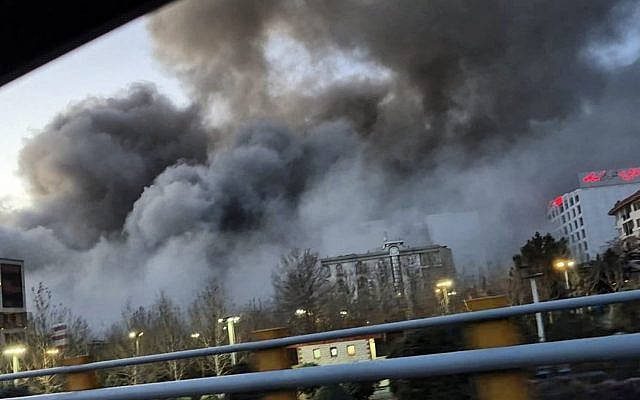 Smoke rises over Tehran's Aghdasieh neighborhood following airstrikes, March 2026. (Photo circulated on social media)