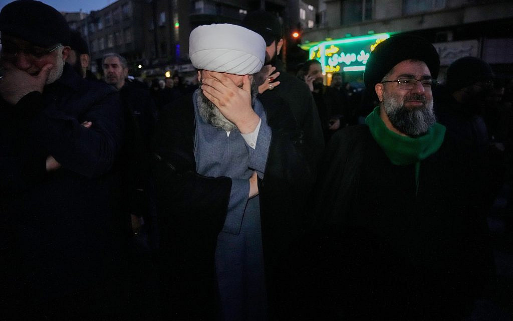 Clerics and other government supporters mourn in a gathering after state TV officially announced the death of Iranian Supreme Leader Ayatollah Ali Khamenei, in Tehran, Iran, Sunday, March 1, 2026. (AP Photo/Vahid Salemi)