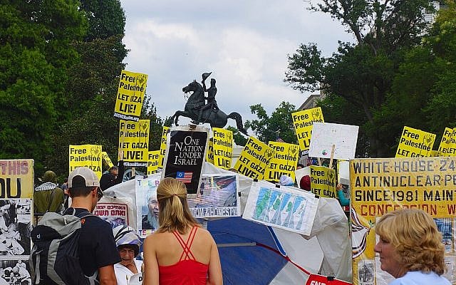 Anti-Israel protest in Lafayette Square outside the White House in Washington, DC in 2014, featuring a "One Nation Under Israel" poster. (Photo by Ted Eytan / via Flickr)