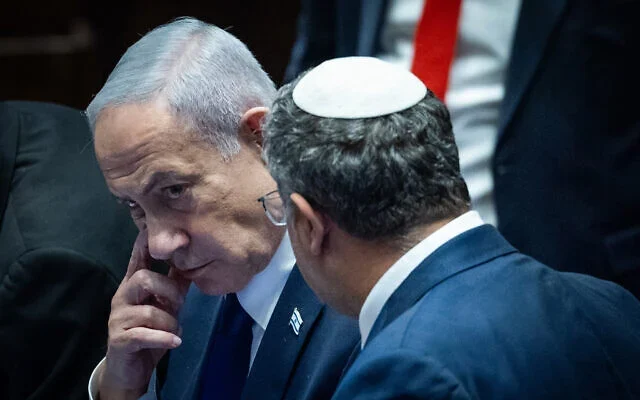 Prime Minister Benjamin Netanyahu speaks with National Security Minister Itamar Ben Gvir during a '40-signature' debate at the Knesset in Jerusalem, on November 10, 2025. (Yonatan Sindel/Flash90)
