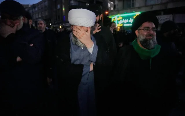 Clerics and other government supporters mourn in a gathering after state TV officially announced the death of Iranian Supreme Leader Ayatollah Ali Khamenei, in Tehran, Iran, Sunday, March 1, 2026. (AP Photo/Vahid Salemi)