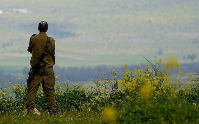 An Israeli soldier stands near the Israeli border with Lebanon amid the ongoing war with Iran and Hezbollah, March 23, 2026. Photo by Ayal Margolin/Flash90