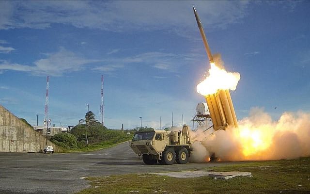 The first of two Terminal High Altitude Area Defense (THAAD) interceptors is launched during a successful intercept test. The test, conducted by Missile Defense Agency (MDA), Ballistic Missile Defense System (BMDS) Operational Test Agency, Joint Functional Component Command for Integrated Missile Defense, and U.S. Pacific Command, in conjunction with U.S. Army soldiers from the Alpha Battery, 2nd Air Defense Artillery Regiment, U.S. Navy sailors aboard the guided missile destroyer USS Decatur (DDG-73), and U.S. Air Force airmen from the 613th Air and Operations Center resulted in the intercept of one medium-range ballistic missile target by THAAD, and one medium-range ballistic missile target by Aegis Ballistic Missile Defense (BMD). The test, designated Flight Test Operational-01 (FTO-01), stressed the ability of the Aegis BMD and THAAD weapon systems to function in a layered defense architecture and defeat a raid of two near-simultaneous ballistic missile targets