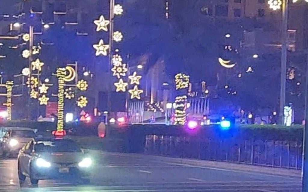 Police and emergency vehicles outside the Fairmont Hotel where an Iranian drone struck 30 minutes prior, causing damage and injuries.