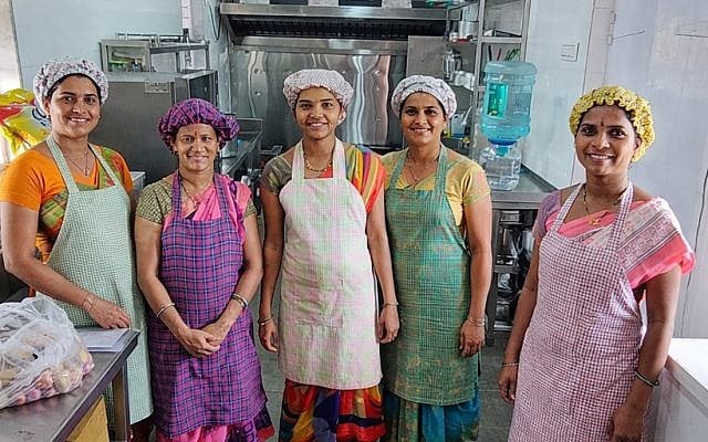 Women cooking at Gabriel Project Mumbai's industrial kitchen for malnourished children.