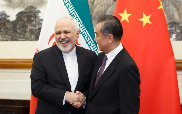 Beijing prioritized global supply chains and domestic economic stability. Photo: China's Foreign Minister Wang Yi (R) meets Iran's Foreign Minister Mohammad Javad Zarif at the Diaoyutai State Guesthouse in Beijing on May 17, 2019. (Thomas Peter/pool/AFP)
