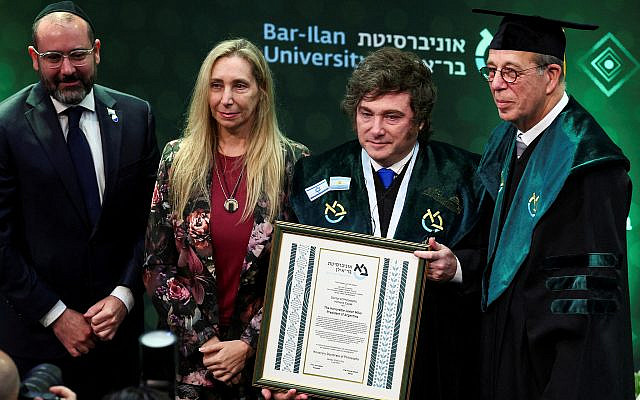 Argentina’s President Javier Milei poses after receiving an honorary doctorate from Bar‑Ilan University, next to his sister Karina Milei, General Secretary of the Presidency of Argentina, Prof. Arie Zaban, President of Bar‑Ilan University, and Argentina’s Ambassador to Israel, Shimon Axel Wahnish, in Ramat Gan, Israel, April 20, 2026. (REUTERS/Florion Goga)