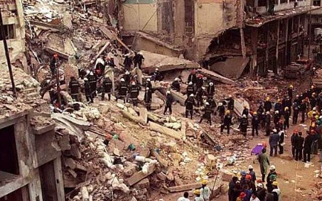 Rescue teams search through -- the wreckage of the Jewish community center in Buenos Aires after the July 18, 1994 bombing. (AP)