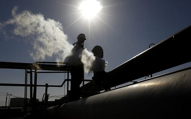FILE - In this Feb. 26, 2011 file photo, a Libyan oil worker, works at a refinery inside the Brega oil complex, in Brega, eastern Libya. On Sunday, Jan. 19, 2020, Libya’s National Oil Corporation said that guards under the command of Khalifa Hifter’s forces shut down two key oil fields in the country’s southwestern desert, following the earlier closure of all eastern export terminals.(AP Photo/Hussein Malla, File)