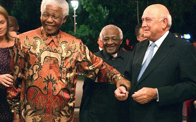 Former South African presidents Nelson Mandela, left, and FW de Klerk, right, with Anglican Archbishop Desmond Tutu, center, at de Klerk's 70th birthday party in Cape Town, South Africa, March 17, 2006. (AP Photo/Obed Zilwa, file)