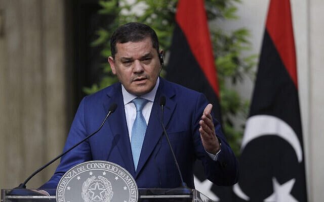 FILE - Libyan Prime Minister Abdulhamid Dbeibeh delivers his statement at the end of a meeting with Italian Prime Minister Mario Draghi at Chigi palace, Premier's office, in Rome, Monday, May 31, 2021. Libya has failed to hold its first presidential election as planned in Dec. 2021. The vote has faced many challenges, including controversial presidential hopefuls, disputes over laws governing the elections and occasional infighting among armed groups. (AP Photo/Gregorio Borgia, Pool, File) FILE - Libyan Prime Minister Abdulhamid Dbeibeh delivers his statement at the end of a meeting with Italian Prime Minister Mario Draghi at Chigi palace, Premier's office, in Rome, Monday, May 31, 2021. Libya has failed to hold its first presidential election as planned in Dec. 2021. The vote has faced many challenges, including controversial presidential hopefuls, disputes over laws governing the elections and occasional infighting among armed groups. (AP Photo/Gregorio Borgia, Pool, File)