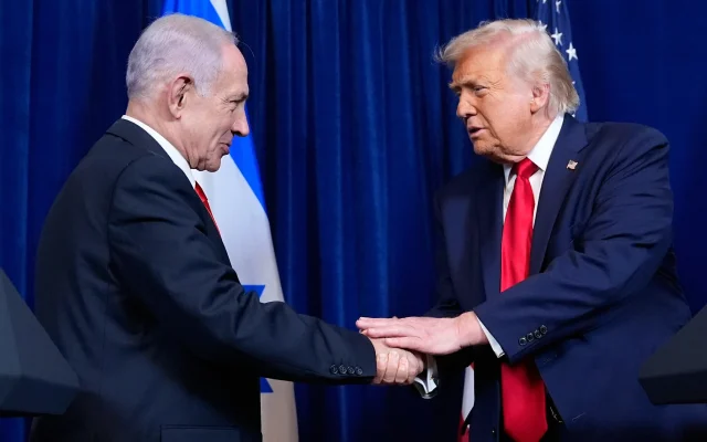 US President Donald Trump, right, shakes hands with Prime Minister Benjamin Netanyahu during a news conference at Mar-a-Lago, December 29, 2025, in Palm Beach, Florida. (AP Photo/Alex Brandon)
