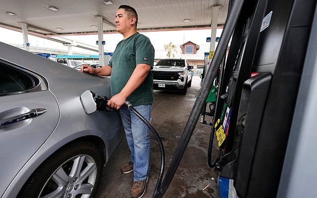 Illustrative: Adrian Perez, of Dallas, pumps gas into his vehicle at Fuel City Friday, April 17, 2026, in Dallas. (AP Photo/Tony Gutierrez)