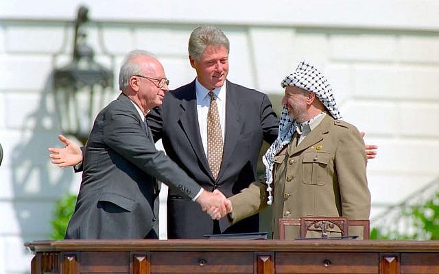 The Prime Minister of Israel, Yitzhak Rabin; the U.S. president, Bill Clinton; and PLO chairman Yasser Arafat at the Oslo Accords signing ceremony on the White House lawn, 1993. Public domain. Source: Wikimedia Commons.