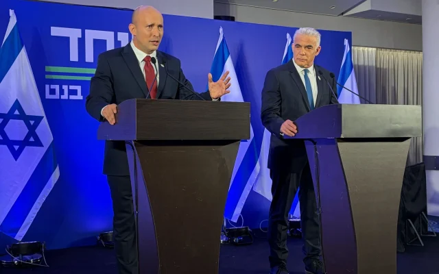Naftali Bennett and Yair Lapid formally announce the formation of their new political union titled Together, April 26, 2026 (Sam Sokol/Times of Israel)