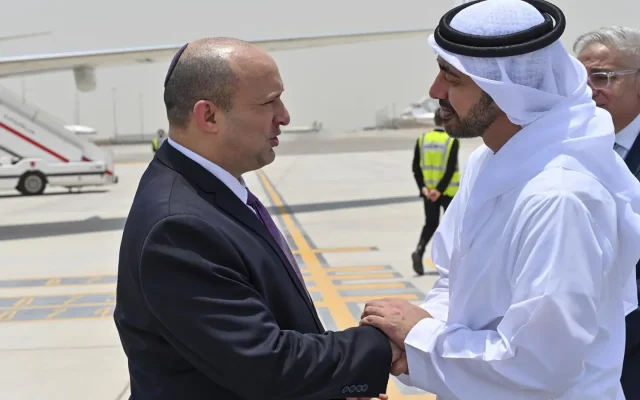 Naftali Bennett and Mohammed Bin Zayed shaking hands (Israel Government Press Office through the  AP)
