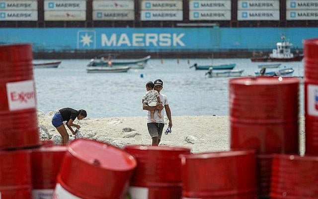 Environmental protest installation outside the Santa Marta Climate Conference in Santa Marta, Colombia. Global energy and trade disruptions are accelerating the search for alternatives — from green energy to the future space economy. (Ivan Valencia / AP)