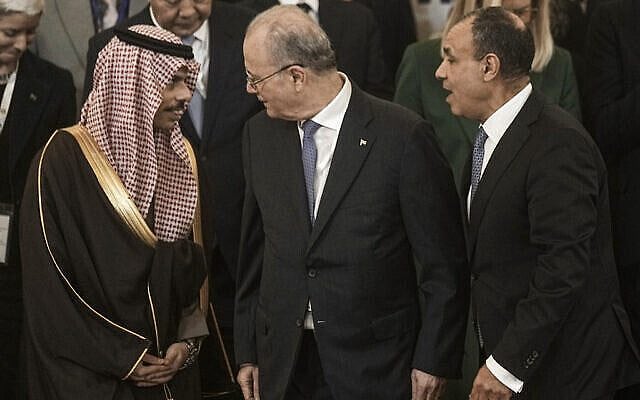 Palestinian Prime minister Mohammed Mustafa, center, and Egyptian Foreign Minister Badr Abdelatty, right, speak to Saudi's Foreign Minister Faisal bin Farhan Al-Saud, during the Cairo Ministerial Conference to Enhance the Humanitarian Response in Gaza, in Cairo, Egypt, Monday, Dec. 2, 2024. (AP Photo/Amr Nabil)