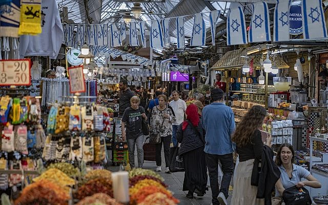 People shop at the Mahane Yehuda Market in Jerusalem on April 15, 2026. (Photo by Yonatan Sindel/Flash90) People shop at the Mahane Yehuda Market in Jerusalem on April 15, 2026. (Photo by Yonatan Sindel/Flash90)