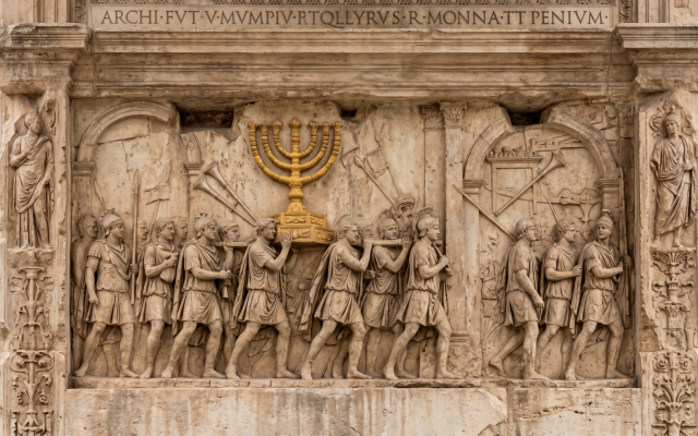 Still standing today and carved shortly after the events of 70 CE. It stands as one of the only contemporary visual records of the Temple's sacred vessels: the Menorah, the silver trumpets, and the Table of the Showbread. It locks the brutal reality of that exile into stone.