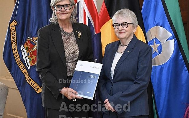 Commissioner for the Royal Commission on Antisemitism and Social Cohesion Virginia Bell, right, delivers her report to Australian Governor-General Sam Mostyn at Government House in Canberra, Australia, Thursday, April 30, 2026. (Lukas Coch/AAP Image via AP)