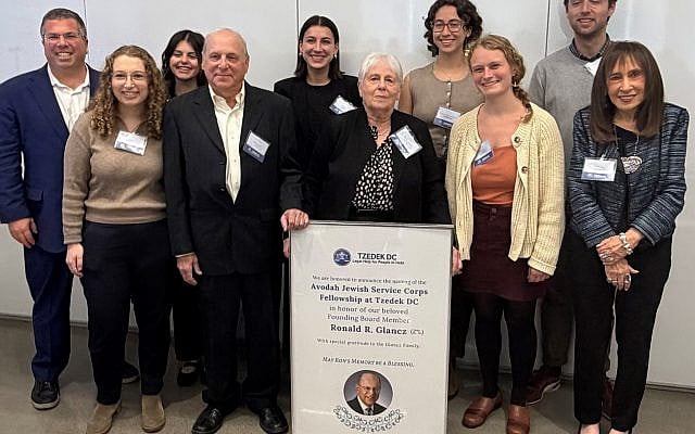 Margie Glancz (center) surrounded by her brother, Tzedek's Ariel Levinson-Waldman, Vivian Bass and numerous Ronald R. Glancz Avodah Jewish Service Corps Fellows who together have enabled real justice to happen. Photo by and courtesy of JLM.