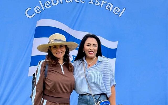 Marina Kahana, VP of Programming and Evolve Chair, Hadassah Long Beach / Orange County (LBOC), and Dr. Deborah Villanueva, President, Hadassah LBOC standing in front of the “Celebrate Israel” backdrop.  Photo courtesy of the author.