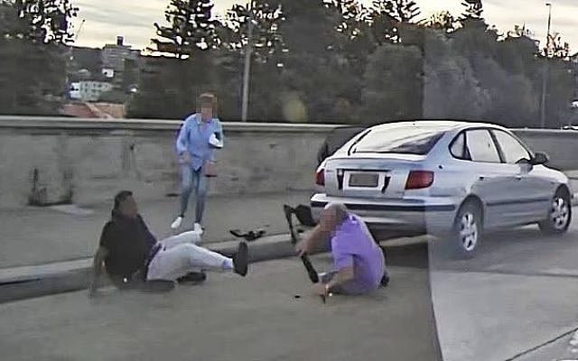 Boris (right) and Sofia Gurman tussle with terrorist Sajid Akram (left) before he carried out the Bondi Beach Hanukkah massacre, December 14, 2025. (Screenshot)