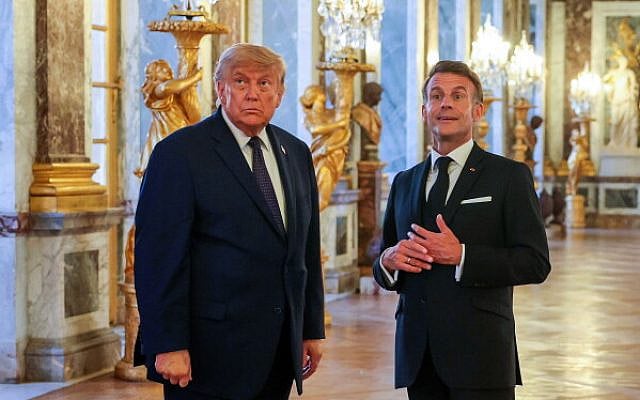 U.S. President Donald Trump with French President Emmanuel Macron in Versailles, France, after signing an agreement with Iran. (Associated Press)