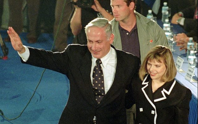 Israeli Prime Minister-elect Benjamin Netanyahu, flanked by his spouse Sarah, waves after addressing supporters at a victory rally in Jerusalem Sunday June 2nd 1996. In his first public speech after winning the elections, Netanyahu pledged to continue peace talks with the Palestinians and other Arabs. (AP PHOTO/MATI)