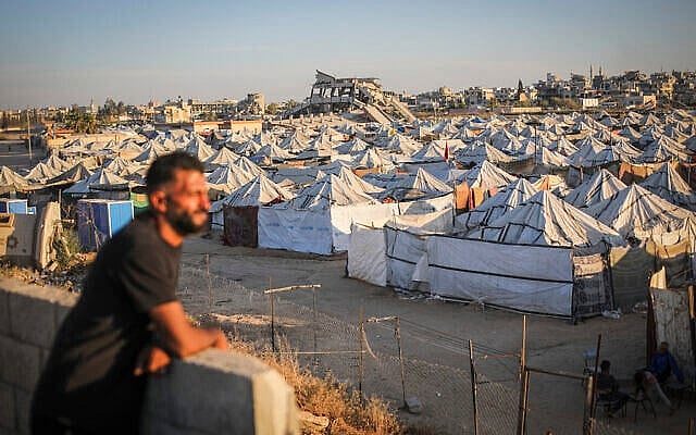 Displaced Palestinians are seen near their tents in Gaza City, June 1, 2026. (Ali Hassan/Flash90)