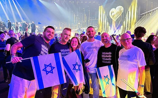 Fans celebrating in the arena at the Eurovision Song Contest Final.