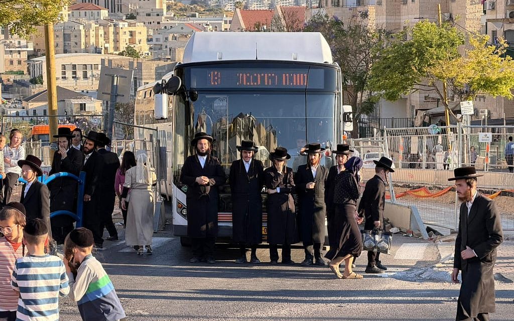 Haredi protesters attempt to block traffic on a road in Beit Shemesh during a demonstration on June 9, 2026. (Israel Police)