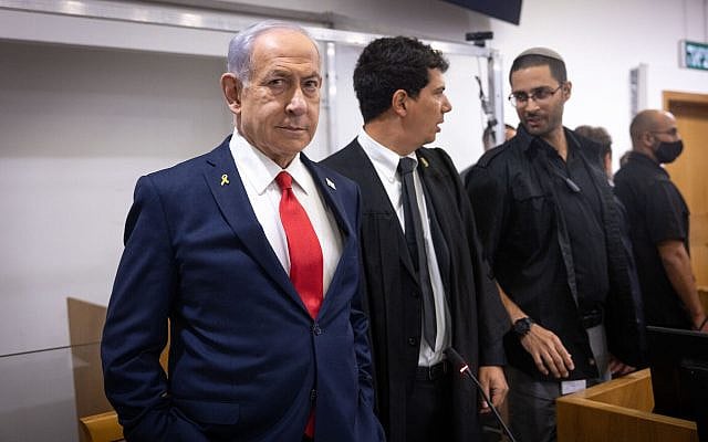 Israeli Prime Minister Benjamin Netanyahu arrives to the courtroom at the Distrcit court in Tel Aviv, before the start of his testimony in the trial against him, October 28, 2025. Photo by Miriam Alster/Flash90 *** Local Caption *** משפט 
בית משפט
ראש הממשלה בנימין נתניהו
ביבי